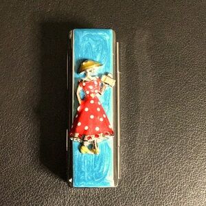Mirrored vintage lip stick case with 3-D polka dot dressed lady decoration